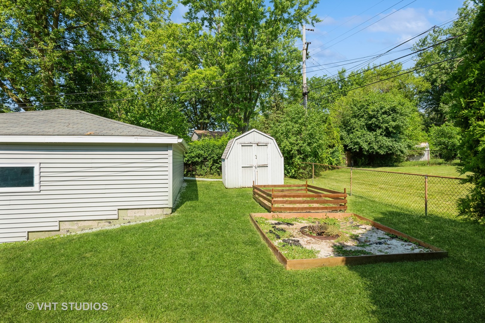 16 East Oltendorf Road Streamwood, IL 60107 - Photo 17 of 18 a view of a backyard with garden