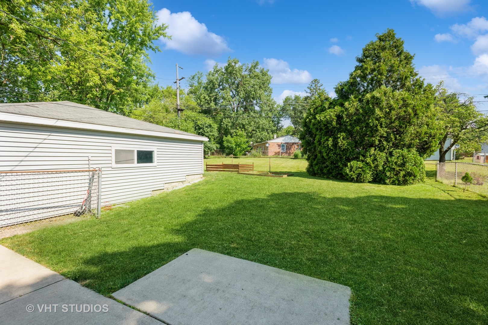 16 East Oltendorf Road Streamwood, IL 60107 - Photo 18 of 18 a view of a backyard with a garden