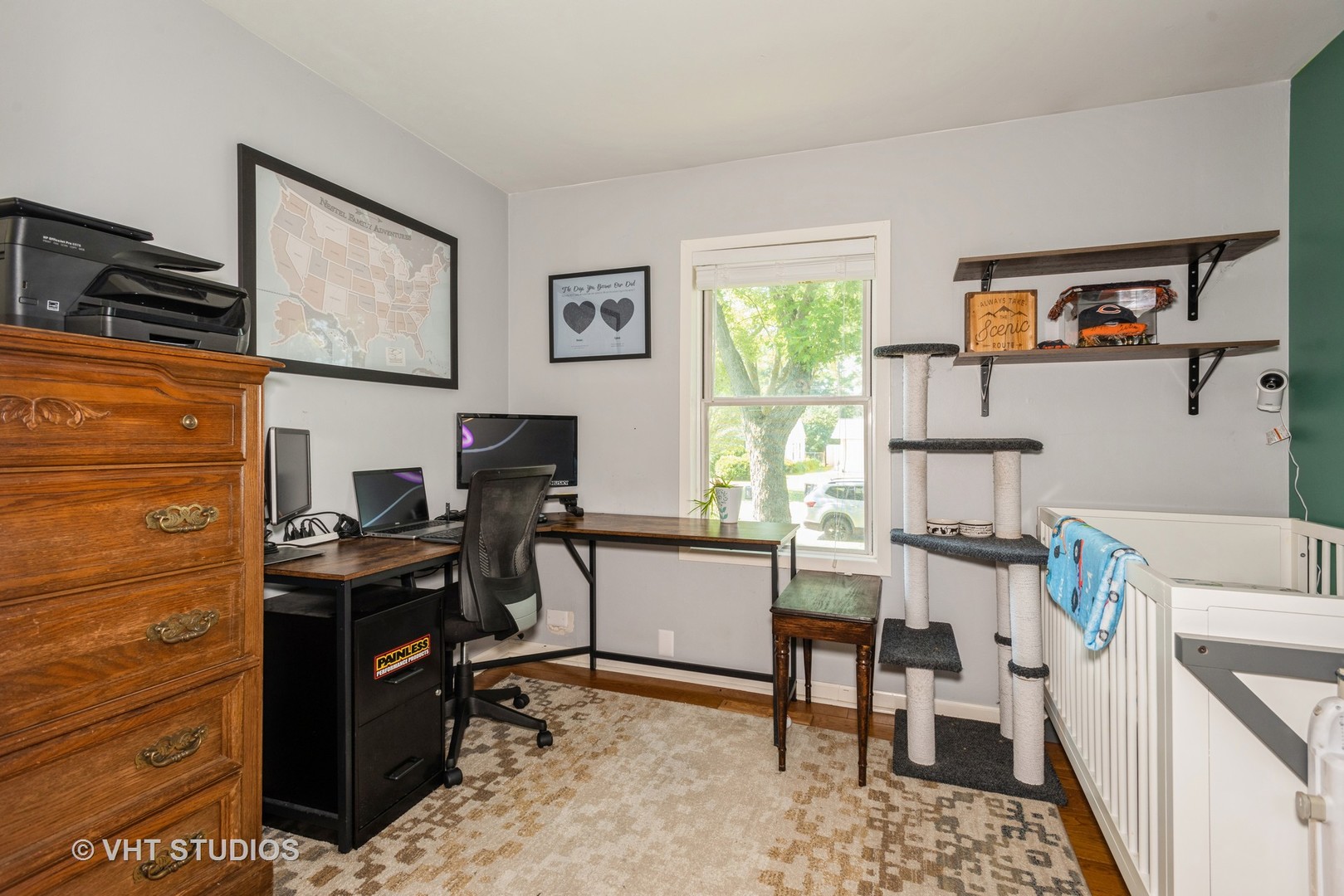 16 East Oltendorf Road Streamwood, IL 60107 - Photo 4 of 18 a view of a workspace with furniture and a window