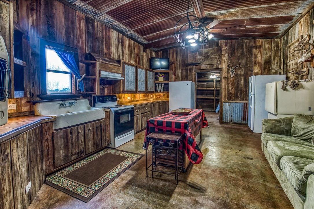 7300 Goehring Road Ledbetter, TX 78946 - Photo 6 of 21 a living room with furniture and a chandelier
