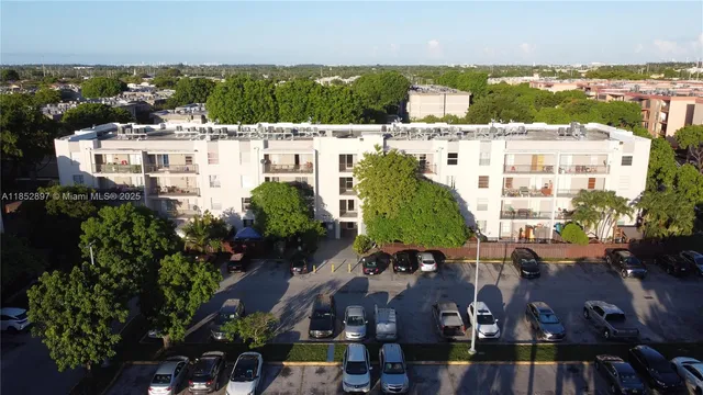 a view of a street with a car parked in front of it