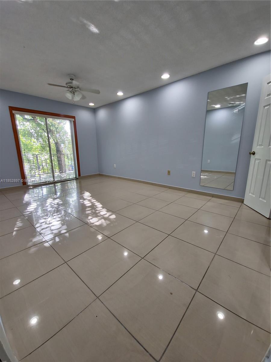 Westland Gardens Condominiums Hialeah, FL 33012 - Photo 7 of 15 a view of a livingroom with windows