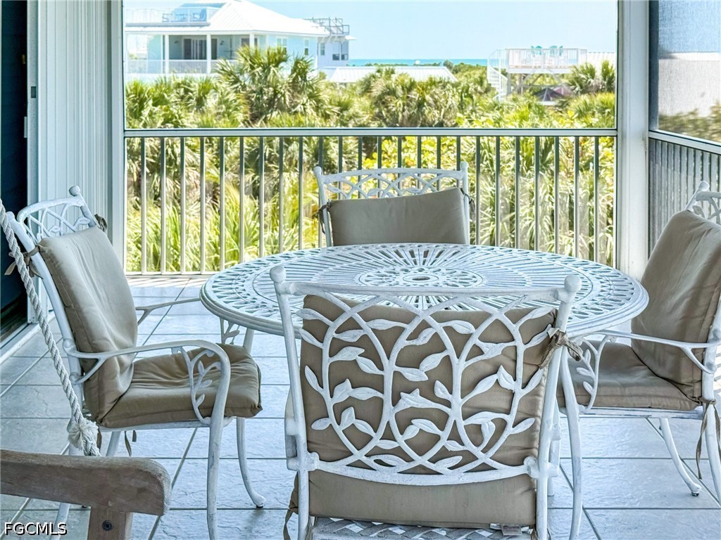4510 Oyster Shell Drive Upper Captiva, FL 33924 - Photo 12 of 50 a view of a dining room with furniture window and outside view