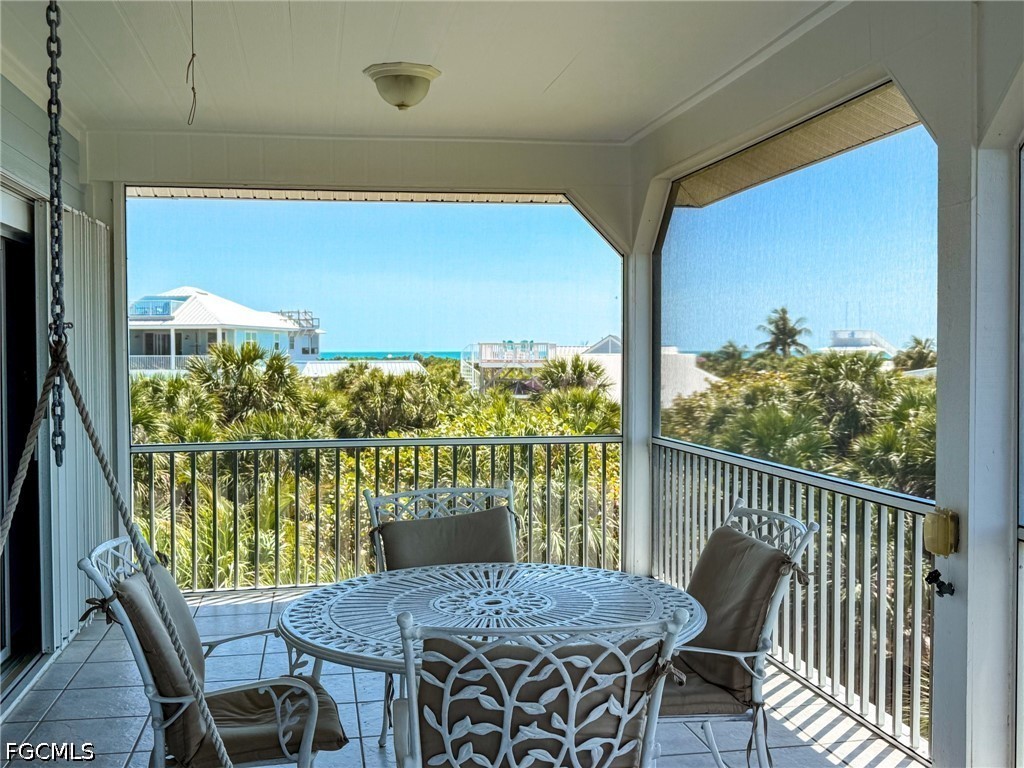 4510 Oyster Shell Drive Upper Captiva, FL 33924 - Photo 13 of 50 a view of a dining room with furniture window and outside view