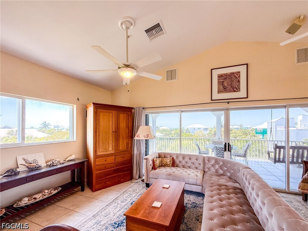 4510 Oyster Shell Drive Upper Captiva, FL 33924 - Photo 26 of 50 a bed room with a bed and a large window