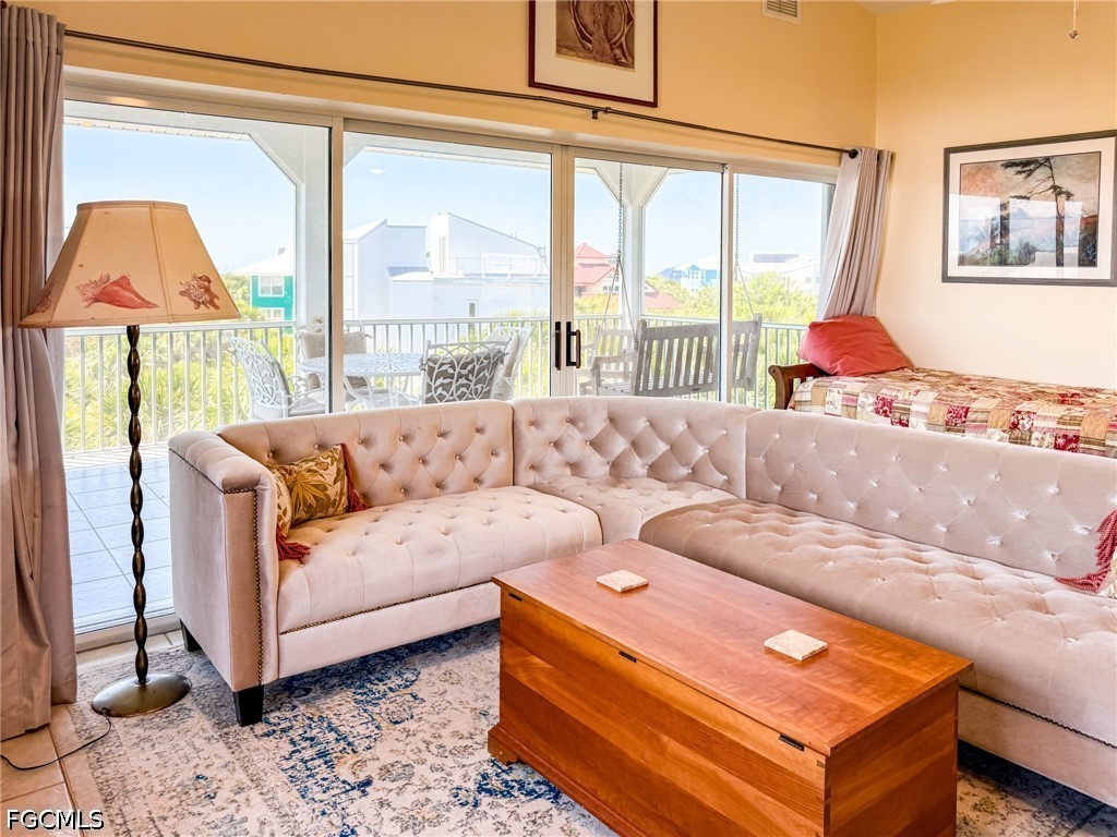 4510 Oyster Shell Drive Upper Captiva, FL 33924 - Photo 28 of 50 a living room with furniture and a large window
