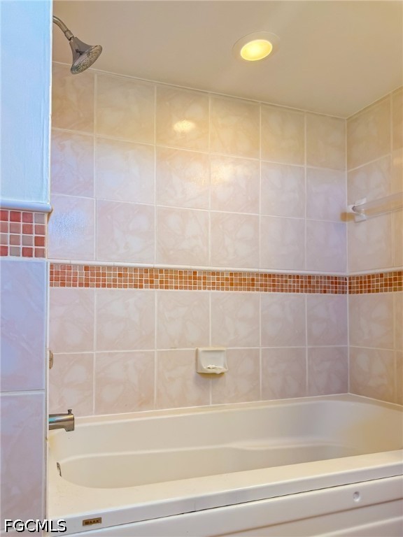 4510 Oyster Shell Drive Upper Captiva, FL 33924 - Photo 40 of 50 a bathroom with a shower and a bath tub