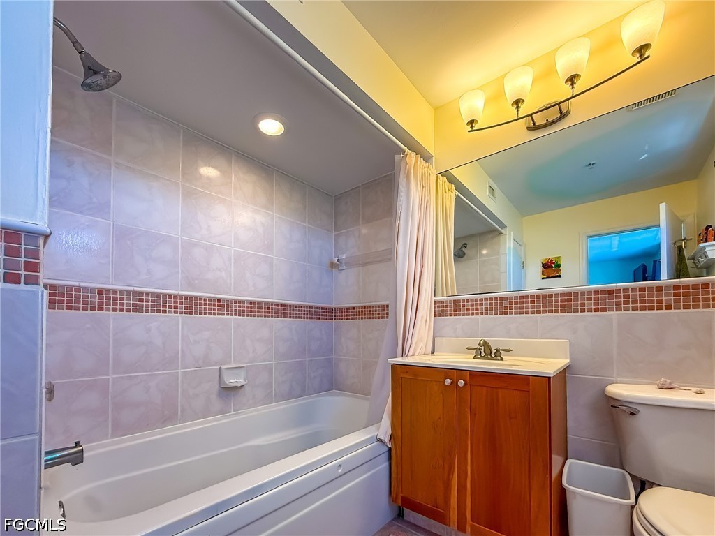 4510 Oyster Shell Drive Upper Captiva, FL 33924 - Photo 41 of 50 a bathroom with a bathtub shower sink vanity and toilet
