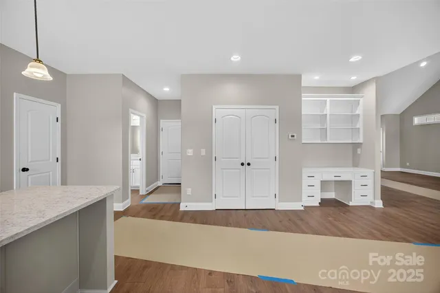 a spacious bathroom with a sink and a mirror
