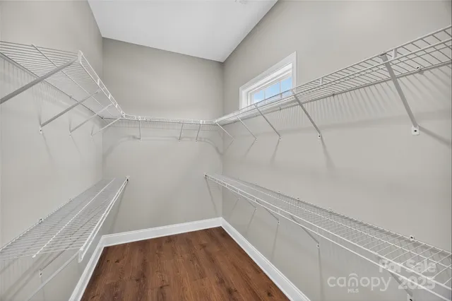a view of an empty walk in closet
