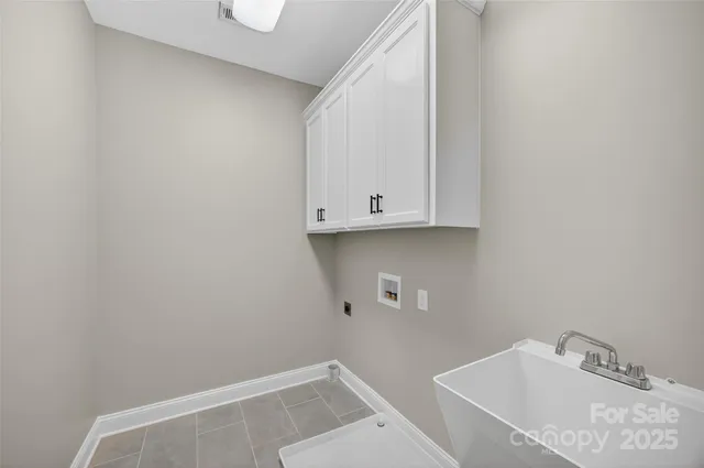 a bathroom with a sink and cabinets