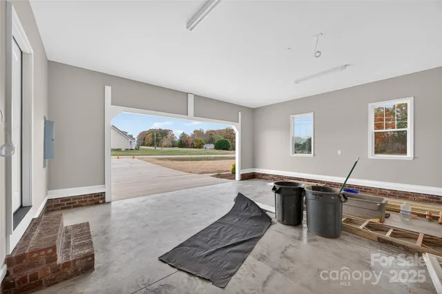 a view of a livingroom with furniture and window