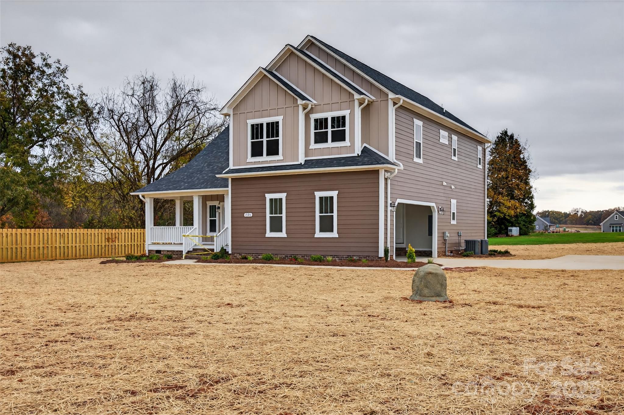 7195 Mooresville Road Salisbury, NC 28147 - Photo 4 of 38 a front view of a house with a yard