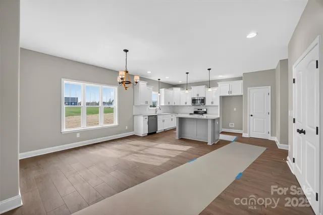 a view of a kitchen with a sink cabinets and a window