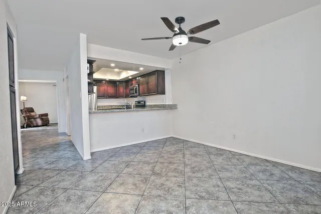 a view of a hallway with a kitchen