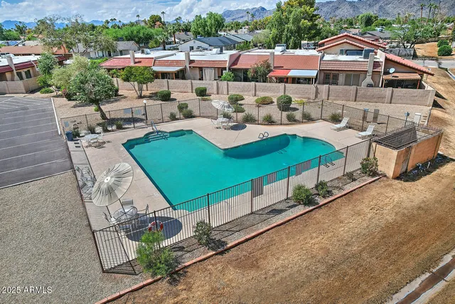 a aerial view of a house with swimming pool and porch