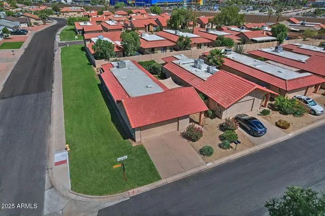 an aerial view of a swimming pool patio outdoor seating and outdoor kitchen view