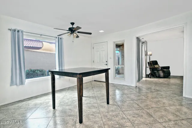 a view of a livingroom with furniture and a window
