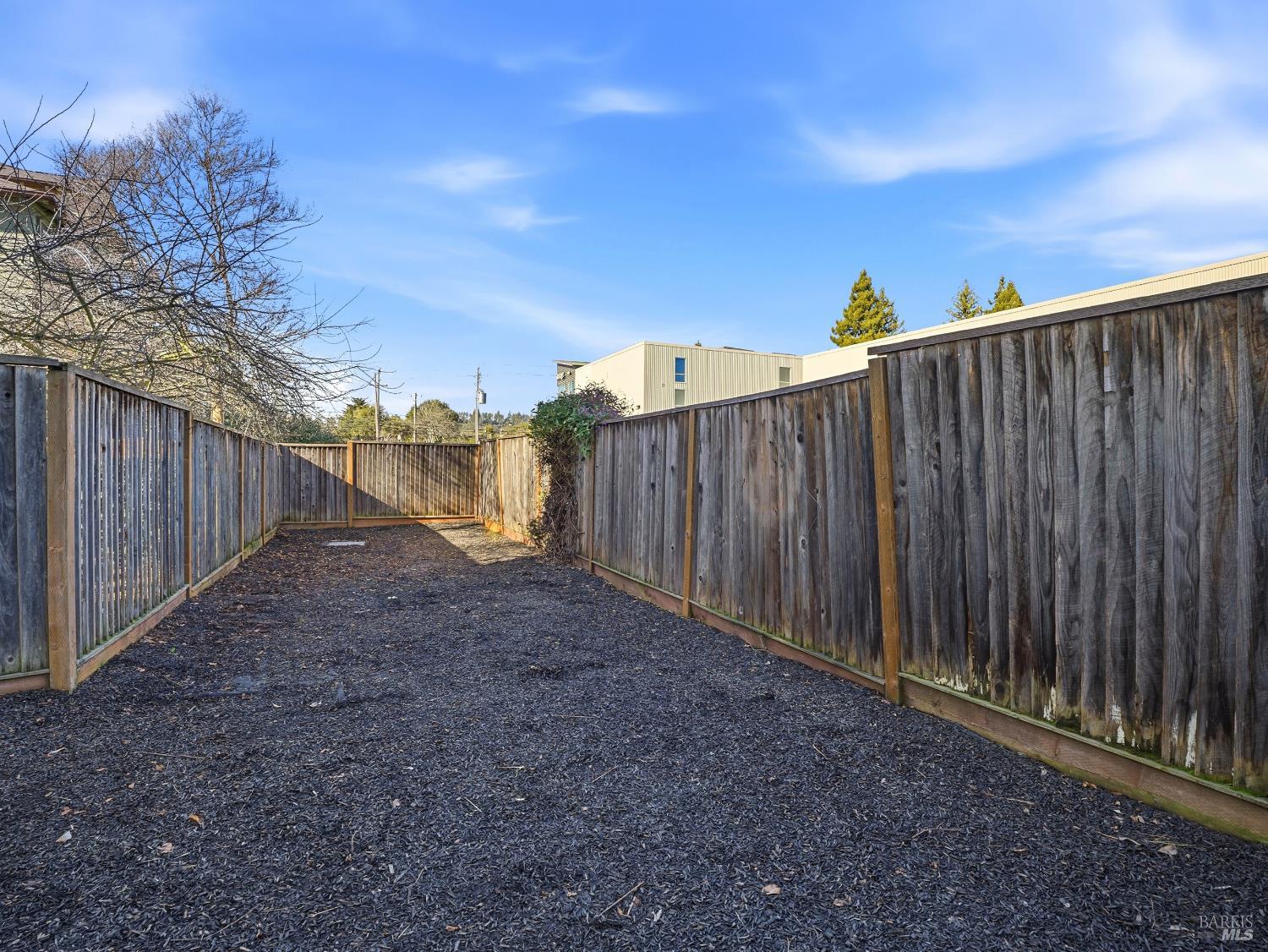 4424 Streamside Drive Santa Rosa, CA 95409 - Photo 52 of 55 a view of a backyard with wooden fence