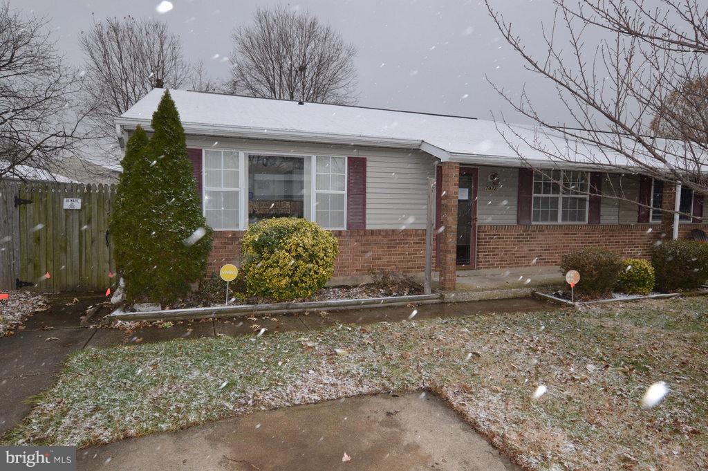 7972 Tick Neck Road Pasadena, MD 21122 - Photo 1 of 19 a front view of a house with a yard