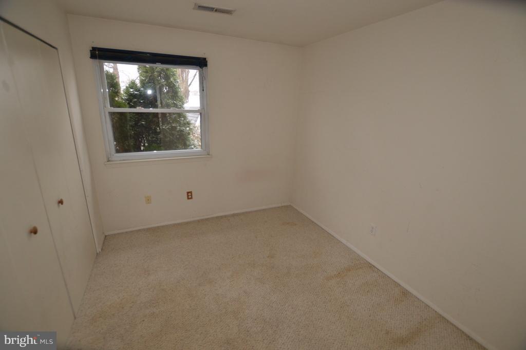 7972 Tick Neck Road Pasadena, MD 21122 - Photo 16 of 19 a view of a window in an empty room
