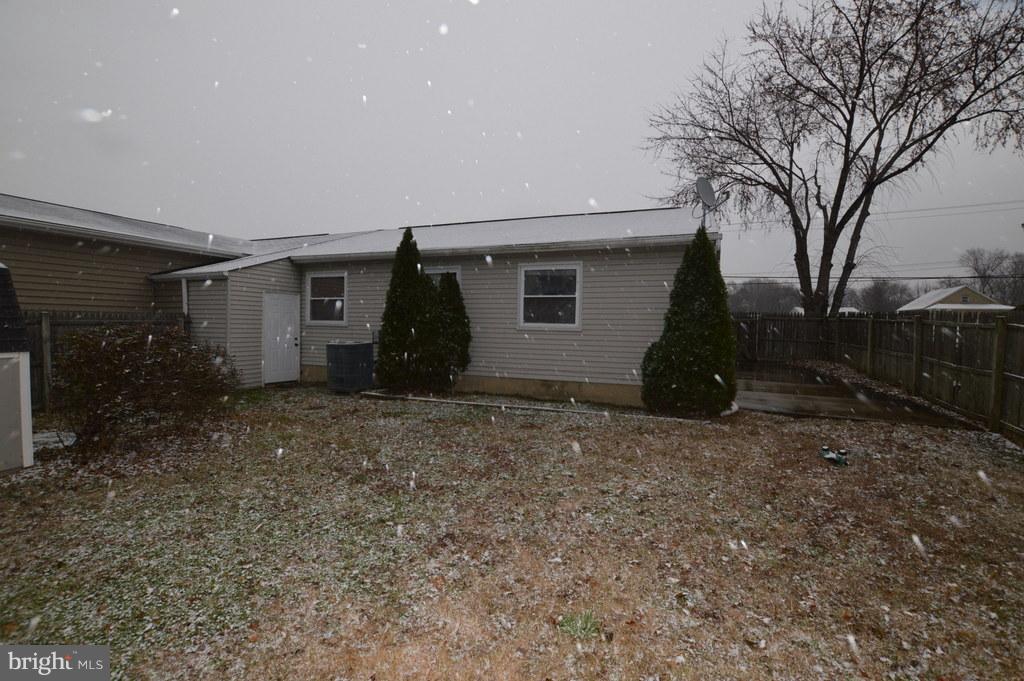 7972 Tick Neck Road Pasadena, MD 21122 - Photo 18 of 19 a house view with a backyard space