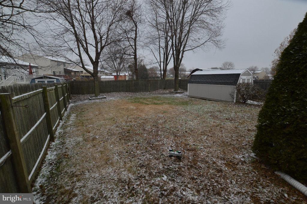 7972 Tick Neck Road Pasadena, MD 21122 - Photo 19 of 19 a backyard of a house with lots of green space