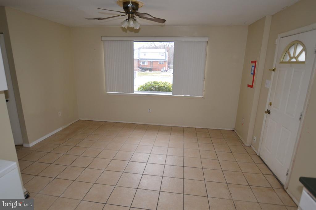7972 Tick Neck Road Pasadena, MD 21122 - Photo 6 of 19 an empty room with windows and fan