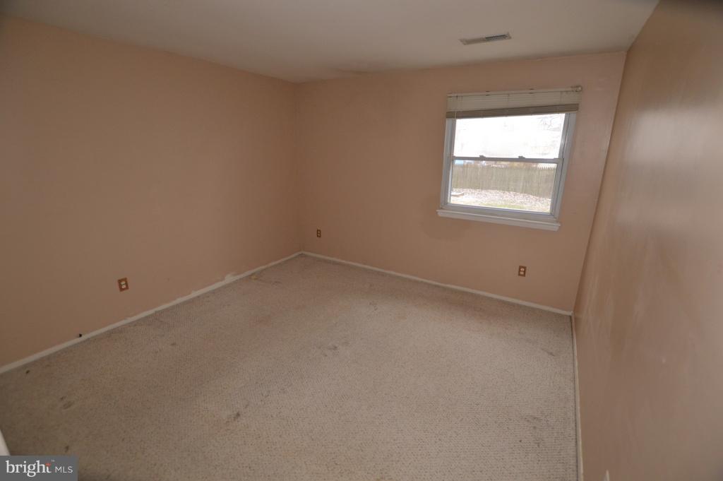 7972 Tick Neck Road Pasadena, MD 21122 - Photo 8 of 19 an empty room with a window