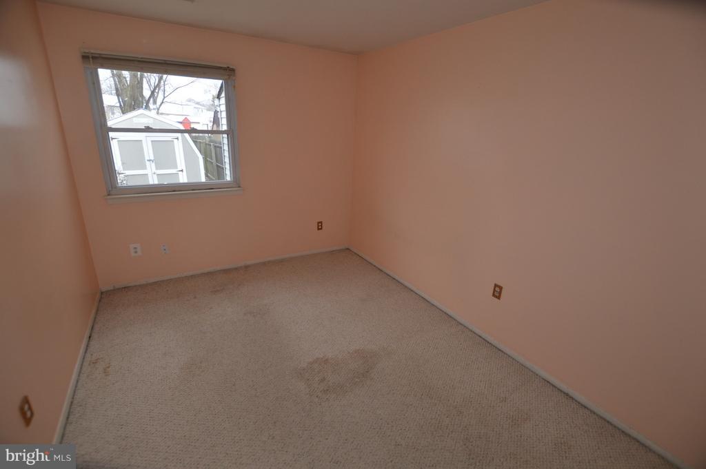 7972 Tick Neck Road Pasadena, MD 21122 - Photo 10 of 19 an empty room with windows