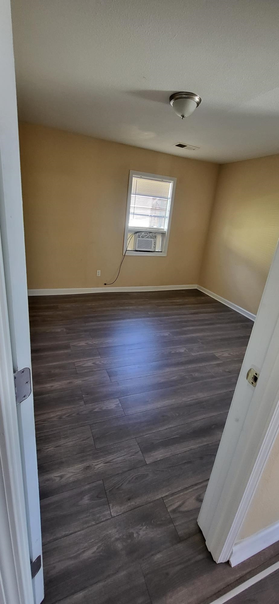 1393 Michigan Street Memphis, TN 38106 - Photo 11 of 27 a view of empty room with window and wooden floor