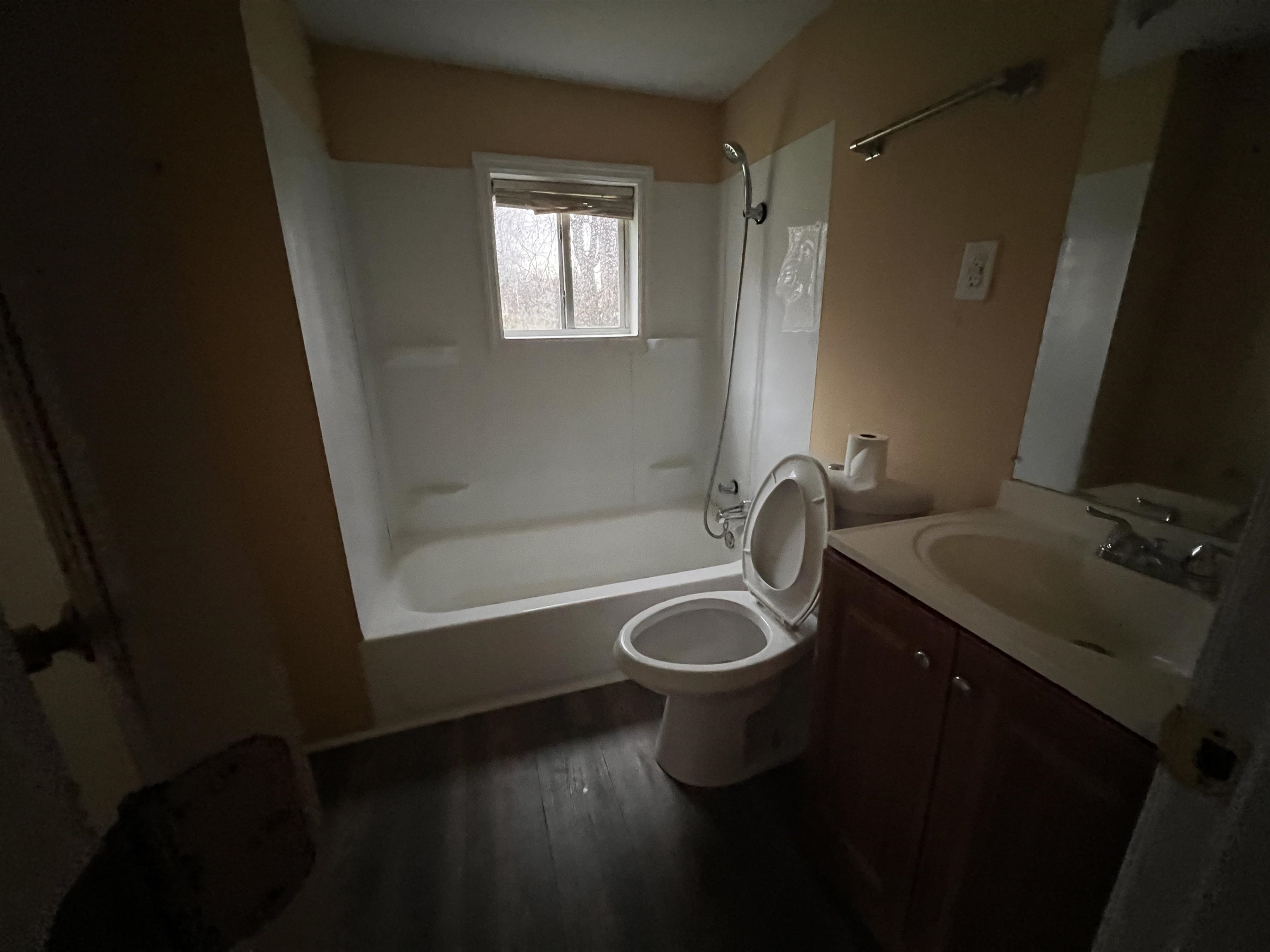 1393 Michigan Street Memphis, TN 38106 - Photo 26 of 27 a bathroom with a granite countertop sink toilet and bathtub
