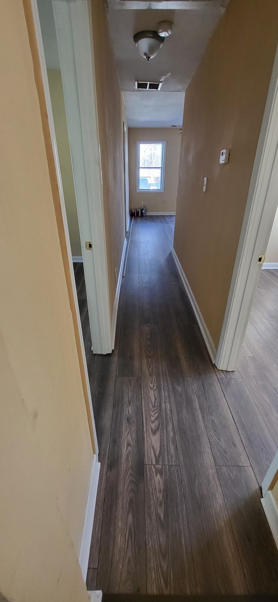 1393 Michigan Street Memphis, TN 38106 - Photo 3 of 27 wooden floor in an empty room with a window