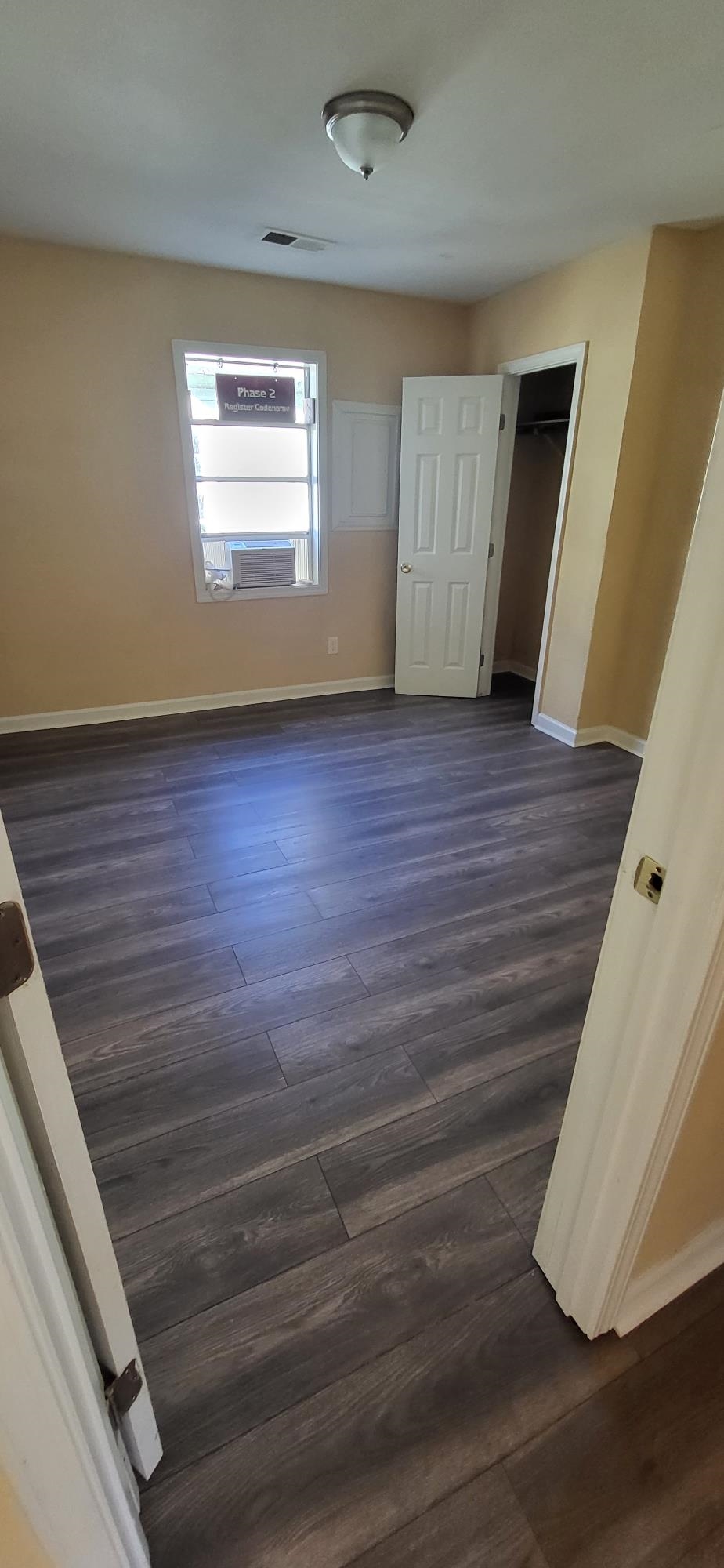 1393 Michigan Street Memphis, TN 38106 - Photo 5 of 27 a view of empty room with window and wooden floor