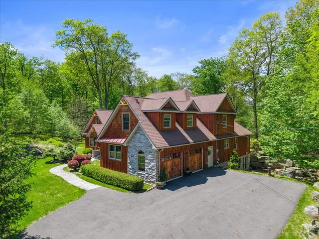 a view of a garden with a building in the background