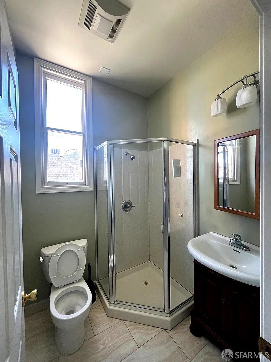 3173 21st Street San Francisco, CA 94110 - Photo 8 of 21 a bathroom with a sink toilet and shower