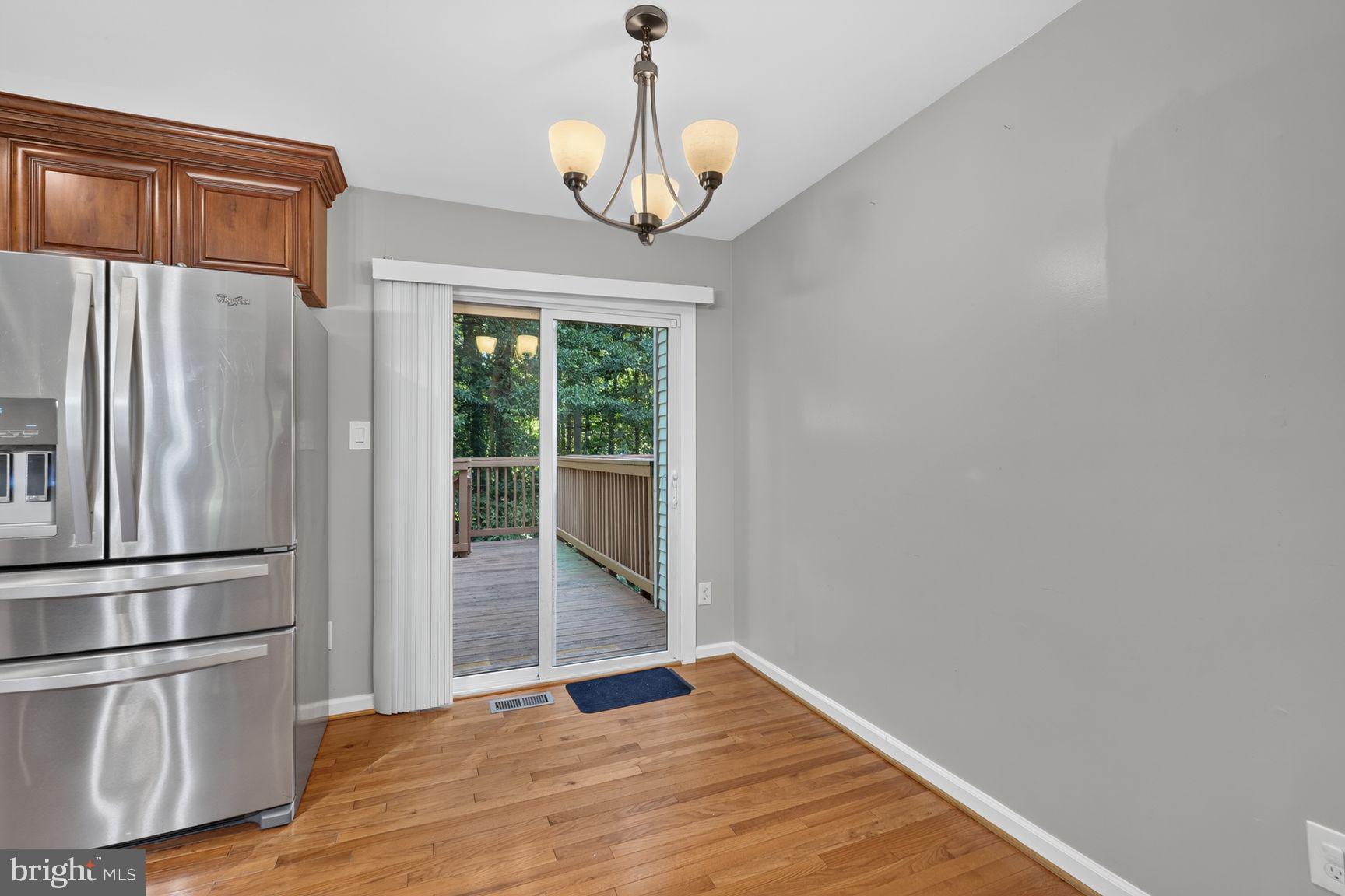 6223 Rathlin Drive Springfield, VA 22152 - Photo 10 of 27 Eat-in area and sliding glass doors to deck