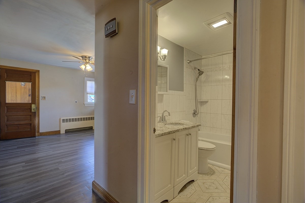 29 Perley Street Lynn, MA 01905 - Photo 14 of 27 a view of a bathroom from the hallway with toilet
