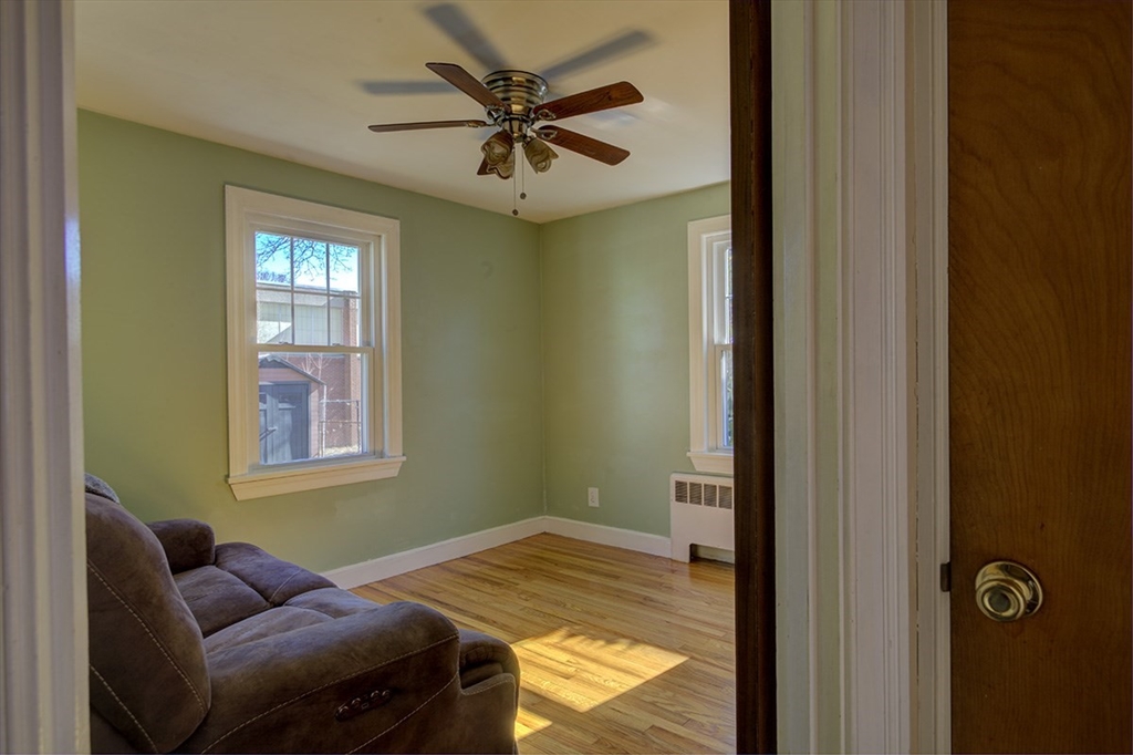29 Perley Street Lynn, MA 01905 - Photo 15 of 27 a bedroom with a bed and a window