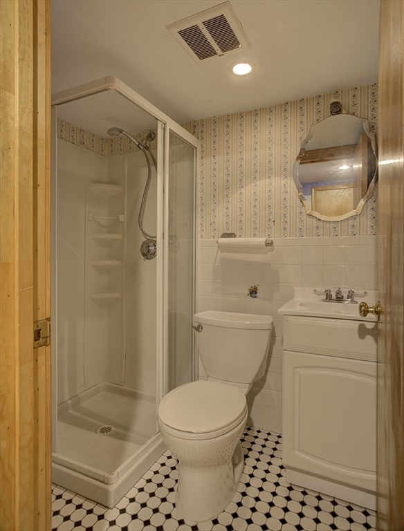 29 Perley Street Lynn, MA 01905 - Photo 19 of 27 a bathroom with a shower a toilet and a shower