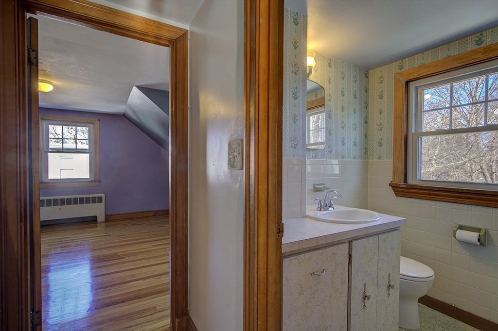 29 Perley Street Lynn, MA 01905 - Photo 22 of 27 a bathroom with a sink a light fixture and a mirror