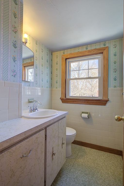 29 Perley Street Lynn, MA 01905 - Photo 23 of 27 a bathroom with a granite countertop sink mirror and a toilet