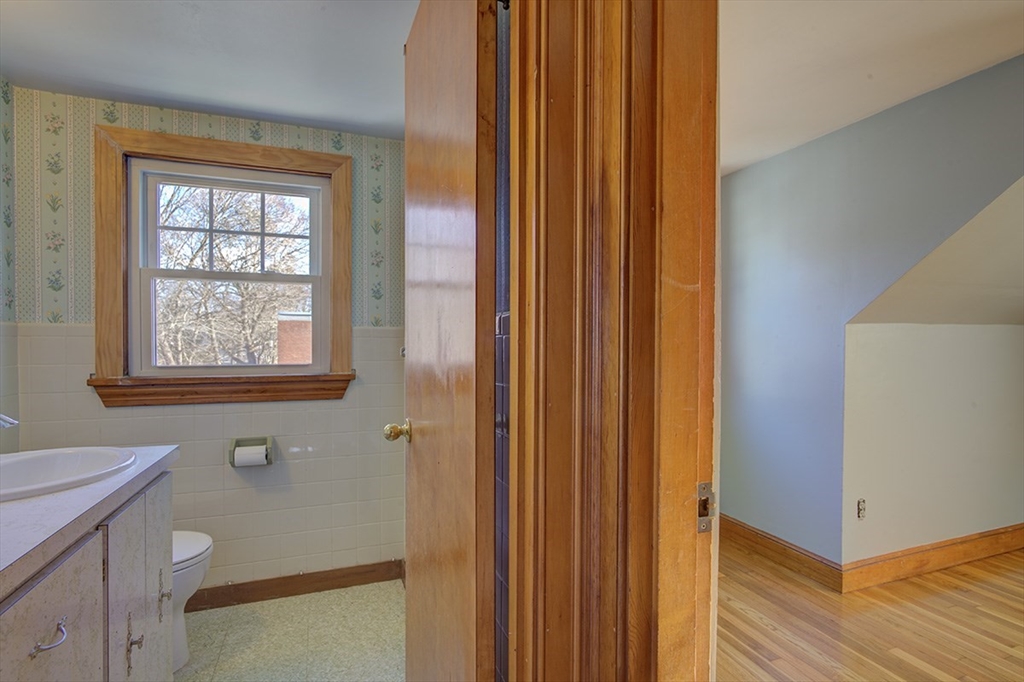 29 Perley Street Lynn, MA 01905 - Photo 24 of 27 a bathroom with a sink and a mirror
