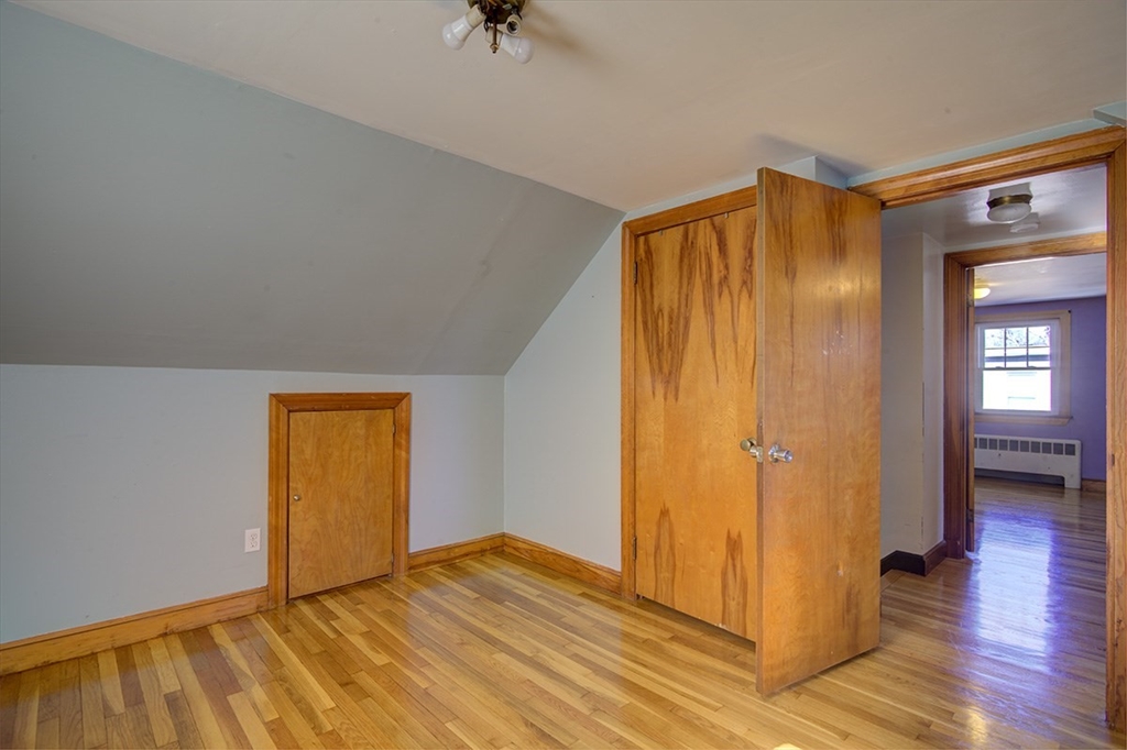 29 Perley Street Lynn, MA 01905 - Photo 26 of 27 a view of empty room with wooden floor and fan