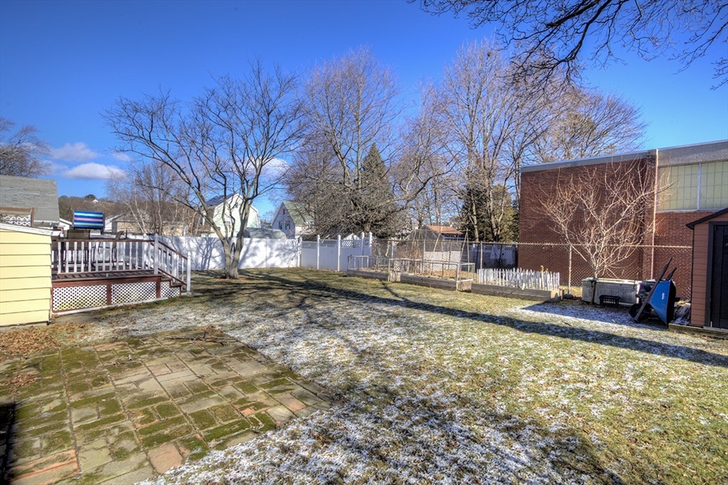 29 Perley Street Lynn, MA 01905 - Photo 5 of 27 a view of a yard with wooden fence