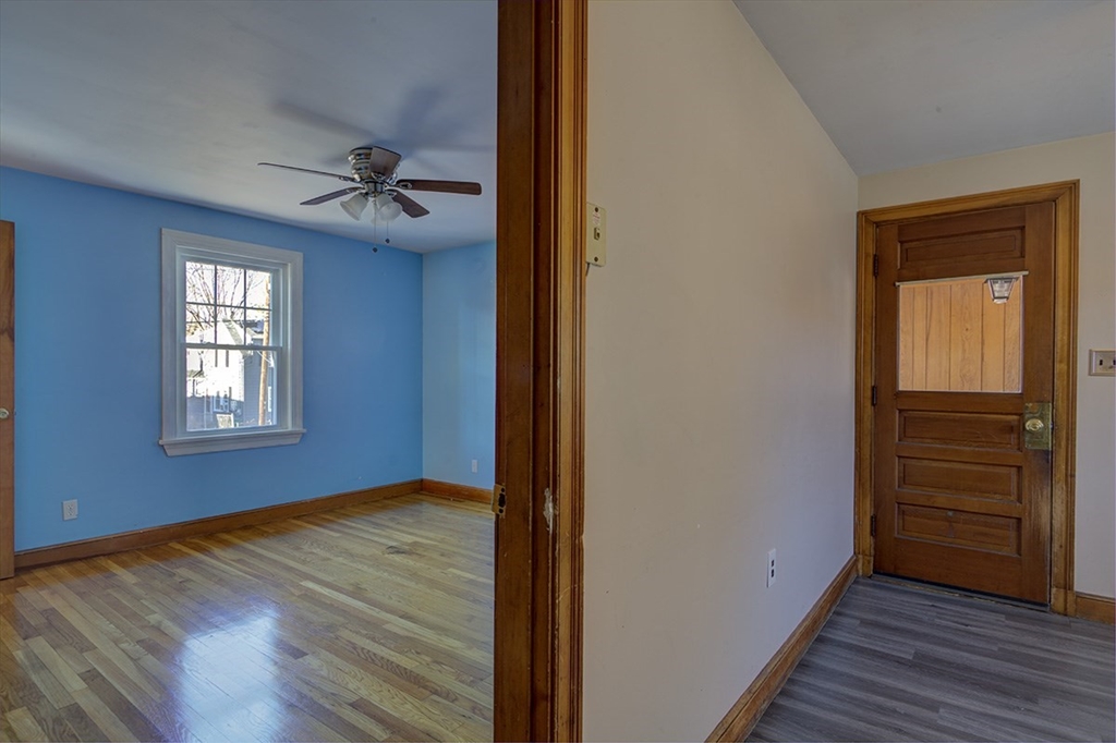 29 Perley Street Lynn, MA 01905 - Photo 9 of 27 a view of empty room with wooden floor and fan