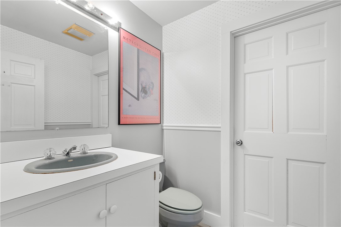 248 Wyatt Road Middletown, RI 02842 - Photo 26 of 50 Half Bath with Doorway to Laundry Room (First Level)