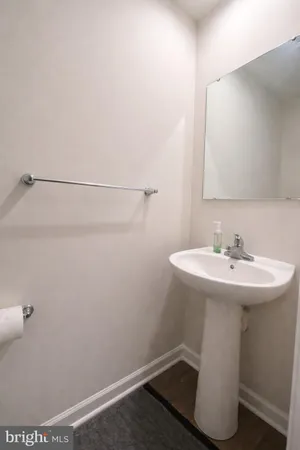 a bathroom with a sink and mirror