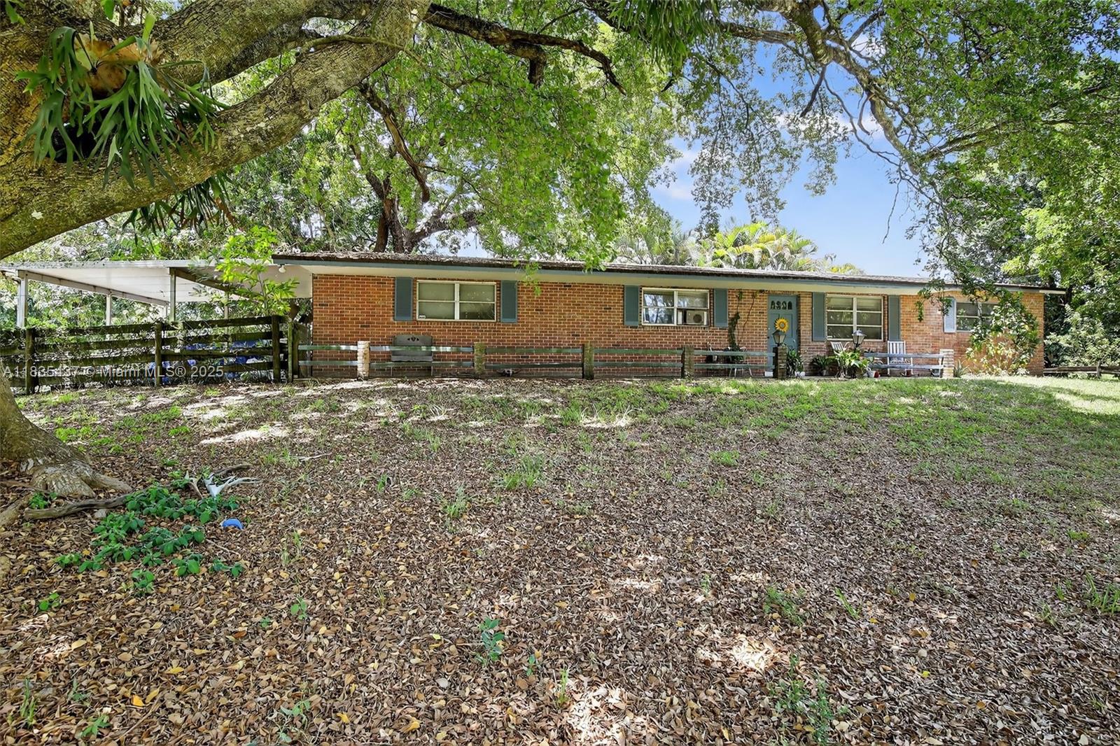 13851 Southwest 26th Street Davie, FL 33325 - Photo 16 of 48 front view of house with a yard