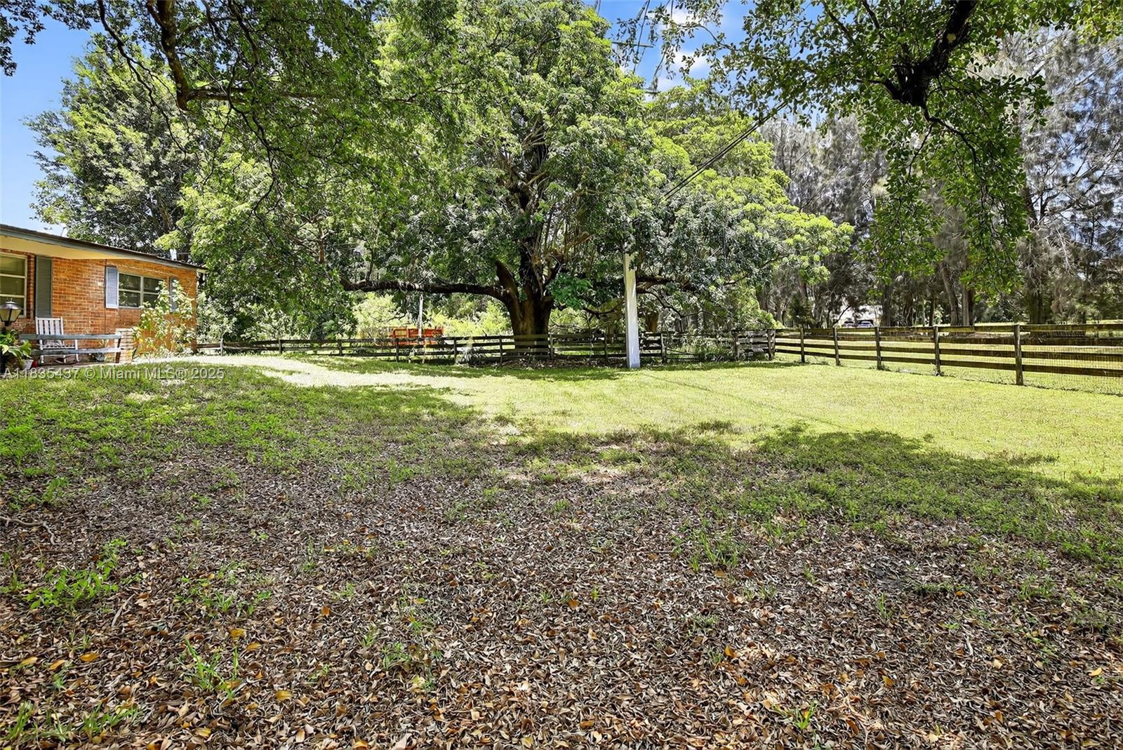 13851 Southwest 26th Street Davie, FL 33325 - Photo 17 of 48 a view of a backyard with large trees